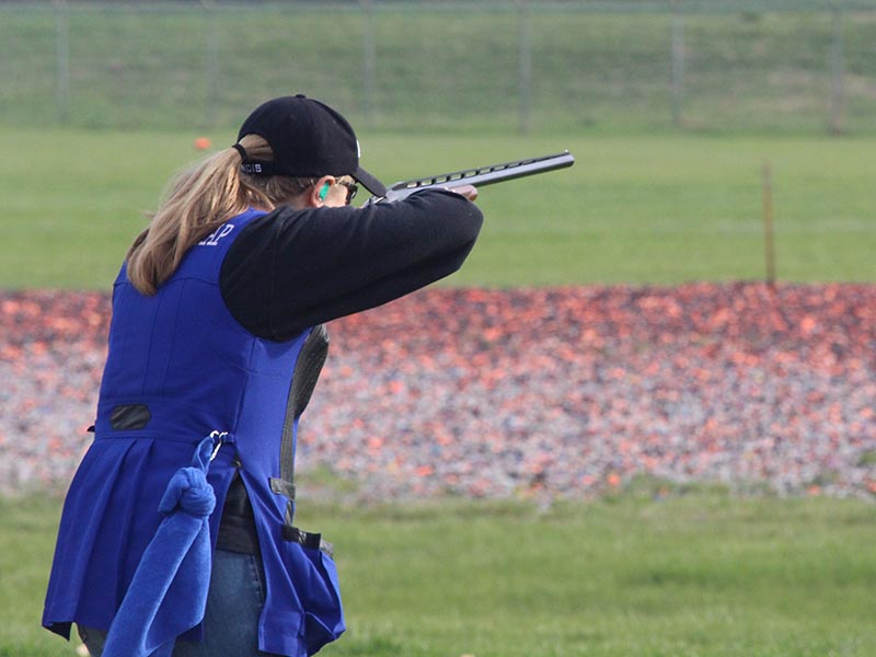 girl shooting shotgun